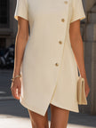 FJØRNA round neck short sleeve asymmetrical button-down mini dress, stylish and modern, shown on a model.
