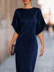 FJØRNA batwing sleeve fluid column maxi dress in elegant evening style, featuring a flowing silhouette and sophisticated design.