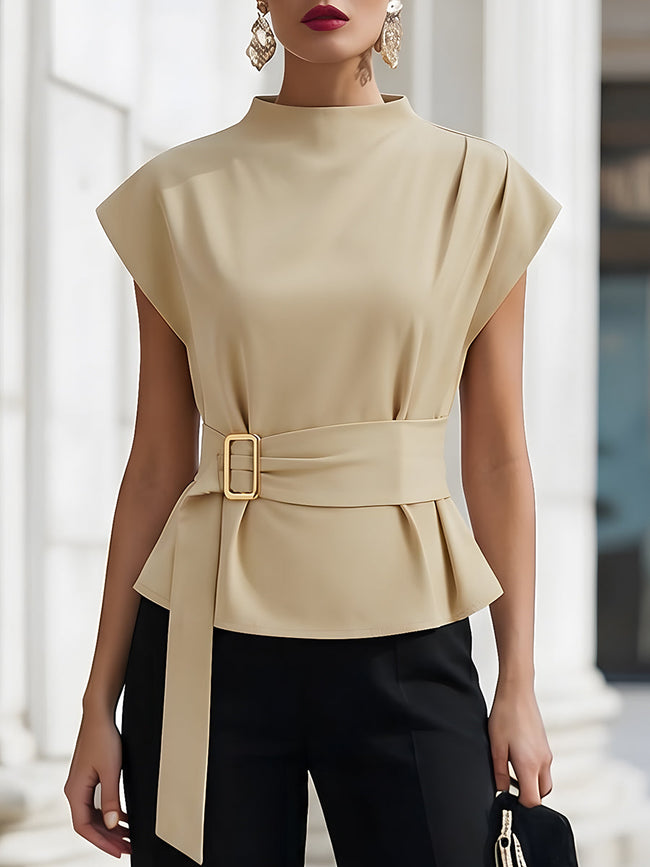 FJØRNA beige sleeveless women's top with high neck, tie waist, and gold belt buckle, showcasing a stylish and elegant design.