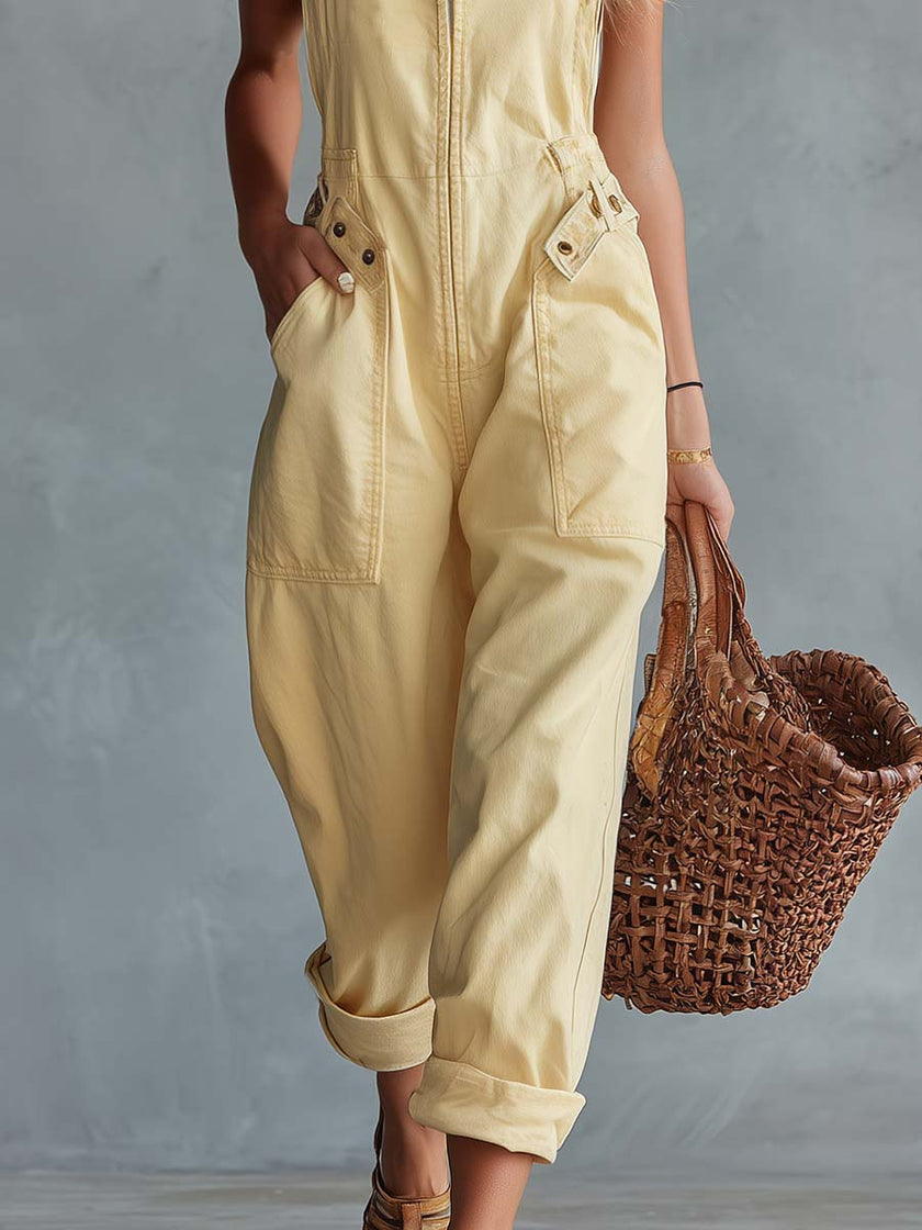 Light yellow denim jumpsuit with square neck and zip-front, women's pants from FJØRNA featuring a stylish, casual design.