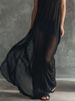 Black mesh hooded maxi dress for women by FJØRNA, featuring a flowing silhouette and sheer fabric with a hood.