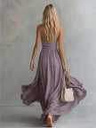 FJØRNA chiffon halter neck maxi dress with elegant design, flowing fabric, suitable for evening occasions.