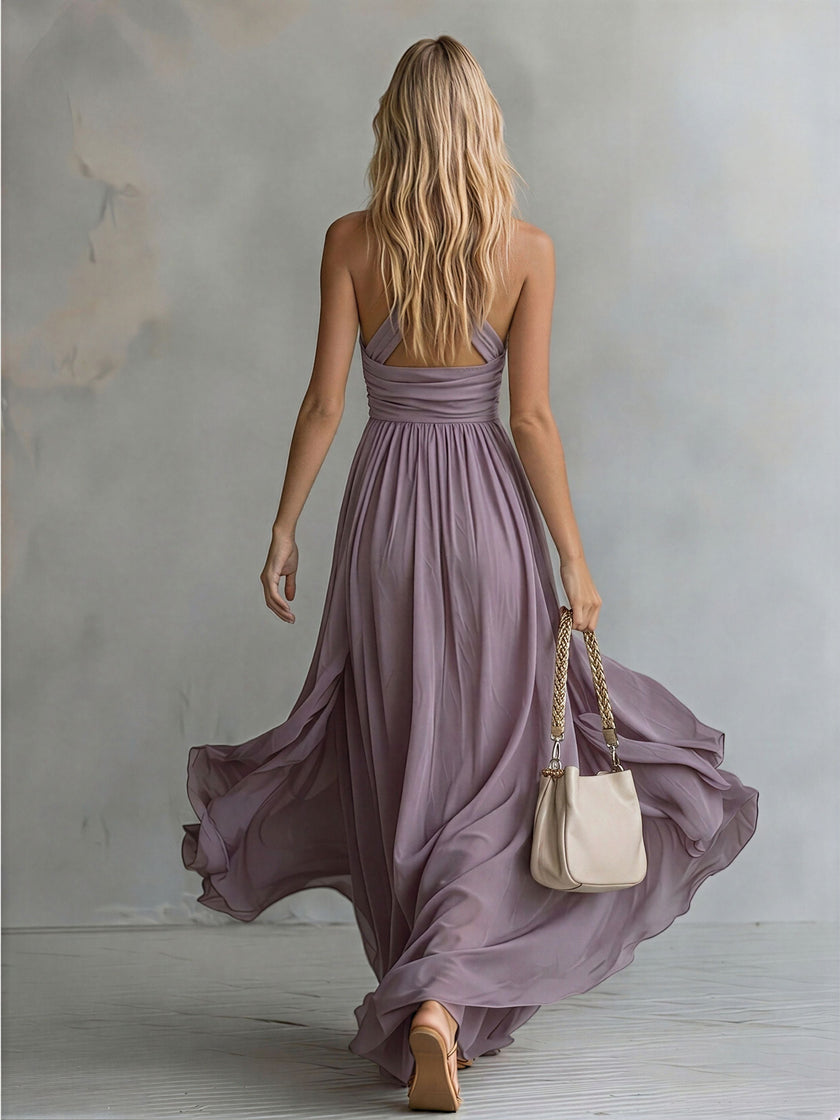 FJØRNA chiffon halter neck maxi dress with elegant design, flowing fabric, suitable for evening occasions.