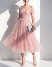 Pink tulle midi dress for women by FJØRNA, featuring a flowy, elegant design with delicate fabric and a flattering fit.