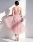 Pink tulle midi dress for women by FJØRNA, featuring a flowing skirt and elegant design for special occasions.