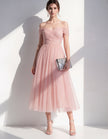 Pink tulle midi dress for women by FJØRNA, featuring a flowy, elegant design with delicate fabric and a fitted waist.