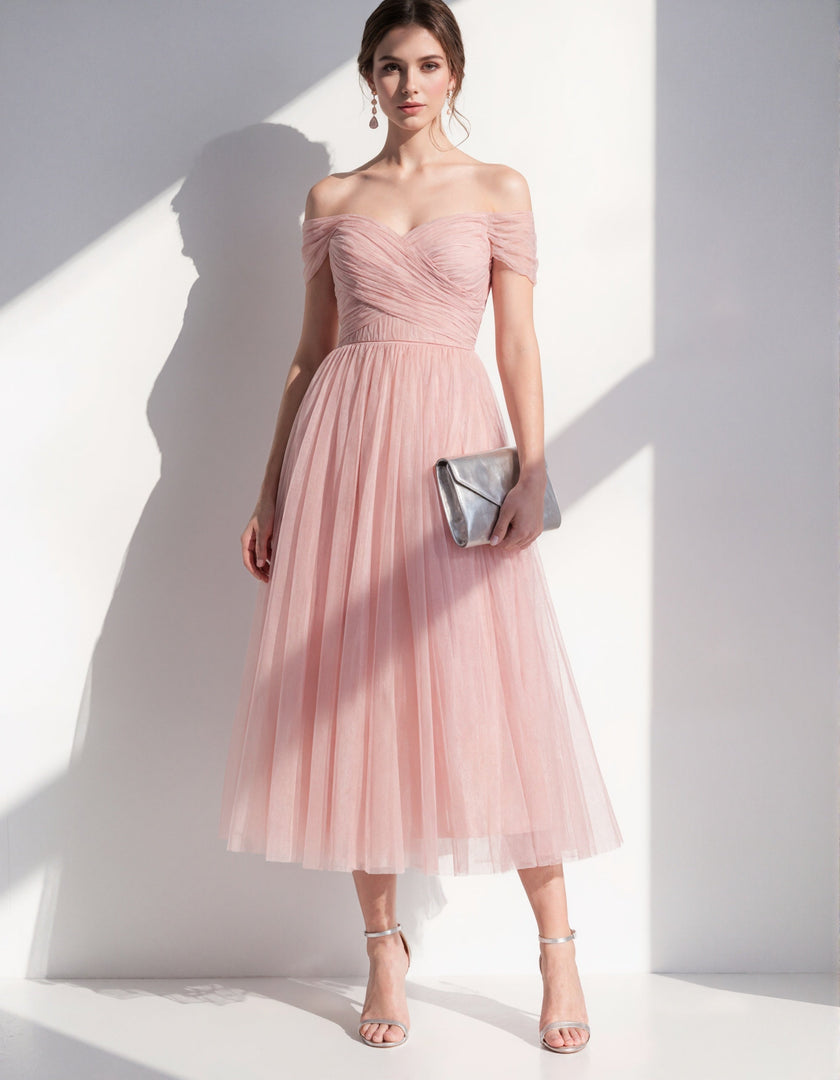 Pink tulle midi dress for women by FJØRNA, featuring a flowy, elegant design with delicate fabric and a fitted waist.