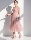 Pink tulle midi dress for women by FJØRNA, featuring a flowy silhouette and elegant design suitable for special occasions.