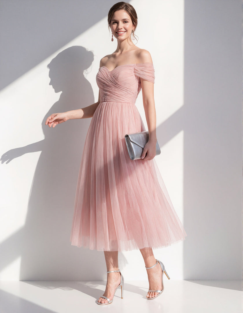 Pink tulle midi dress for women by FJØRNA, featuring a flowy silhouette and elegant design suitable for special occasions.