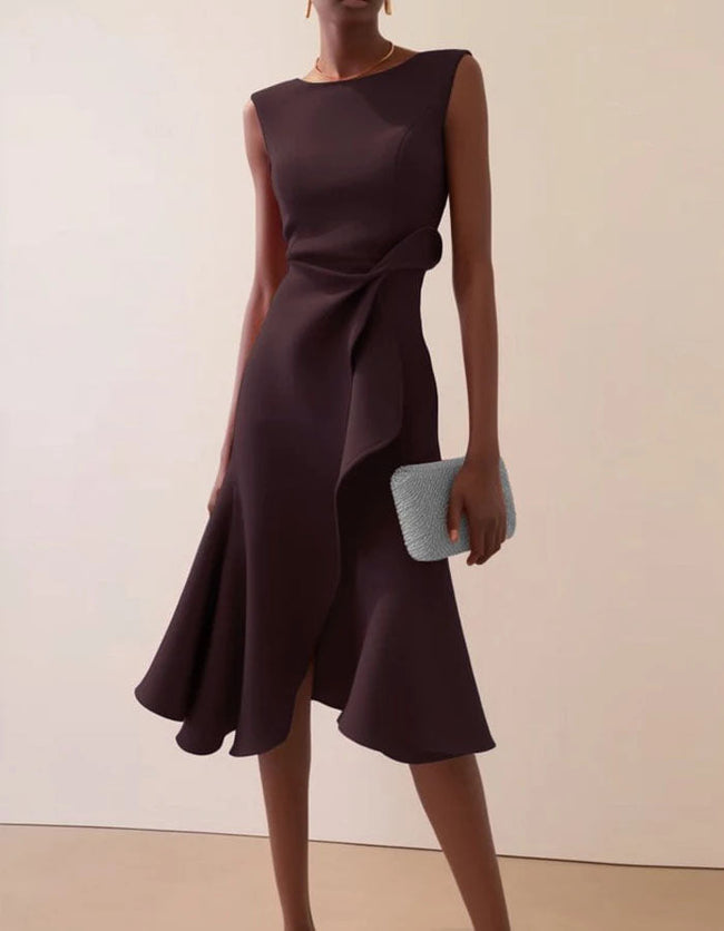 Pink FJØRNA midi dress for women with round neck, sleeveless design, ruffle and bow detail, perfect for elegant occasions.