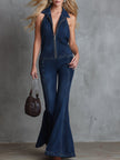 Dark blue denim flared jumpsuit for women by FJØRNA, showing a stylish full-length view with flared pant legs.