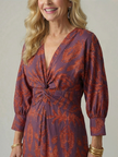 Flowy FJØRNA summer midi dress for women with long sleeves and wrap design, perfect for warm weather and casual occasions.