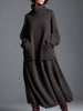Brown knit maxi dress for women by FJØRNA, featuring a long, cozy, and stylish knit fabric with a flowing silhouette.