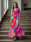 FJØRNA women's floral summer maxi dress with long sleeves, wrap style, flowing fabric, perfect for warm weather.