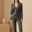 FJØRNA women's tailored 3-piece suit set with tweed fabric, featuring pants and matching blazer and vest, on a model.