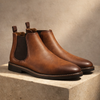 FJØRNA Retro Leather Chelsea Boots for men, showcasing classic black leather shoes with elastic side panels and ankle height.