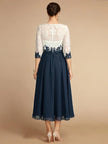 FJØRNA white chiffon midi dress for women with a round neckline, elegant flowy fabric, perfect for formal or casual occasions