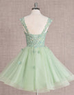 Mint green FJØRNA sleeveless tulle cocktail dress for women, elegant and stylish with a fitted bodice and flowing skirt.