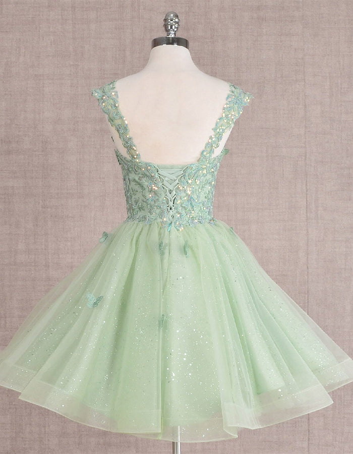 Mint green FJØRNA sleeveless tulle cocktail dress for women, elegant and stylish with a fitted bodice and flowing skirt.