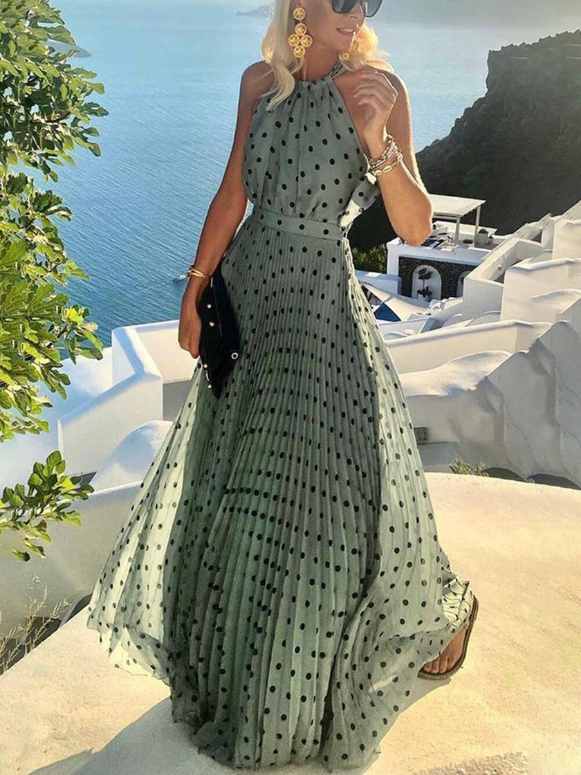 FJØRNA women's summer maxi dress with elegant dot print, flowing fabric, and classic style perfect for warm weather.