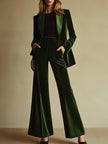 Emerald green velvet two-piece suit set for women, featuring loose pants and stylish top by FJØRNA.