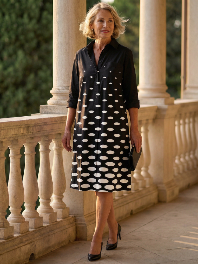 FJØRNA elegant women's polka dot dress with pockets, suitable for evening wear, shown with a fitted silhouette and stylish design.