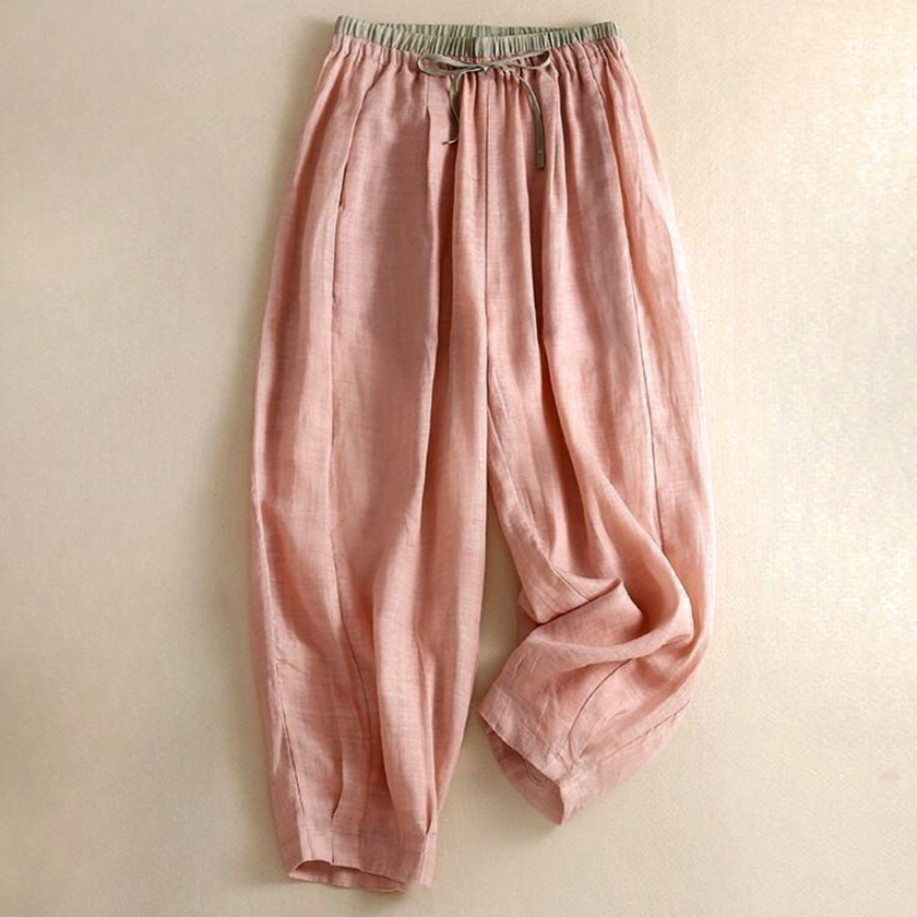 FJØRNA women's linen tapered trousers, light-colored pants with a relaxed fit, displayed on a neutral background.
