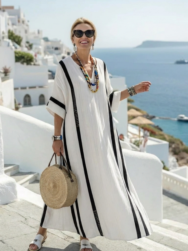 FJØRNA women's summer maxi dress with striped pattern, short sleeves, wrap style, flowy fabric, ideal for warm weather.