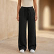 Women’s lightweight cotton wide-leg trousers by FJØRNA, casual pants with relaxed fit and flowy style.