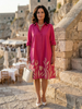 FJØRNA women's floral summer dress with pockets, flowy and lightweight for warm weather, featuring a vibrant floral pattern.
