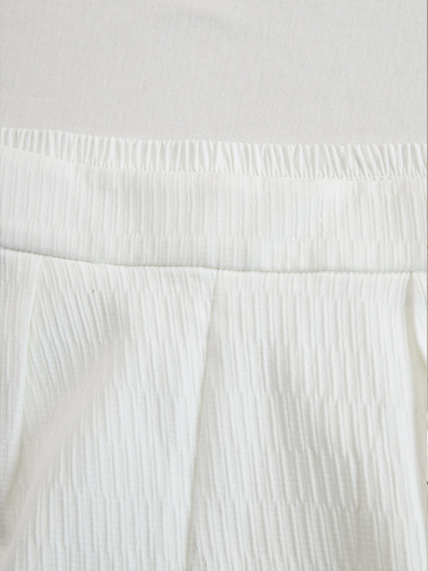 Cream textured lantern sleeve two-piece set for women, featuring stylish pants from FJØRNA with unique sleeve details.