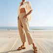 FJØRNA women's wide-leg denim trousers, stylish and comfortable pants featuring a classic blue wash and relaxed fit.