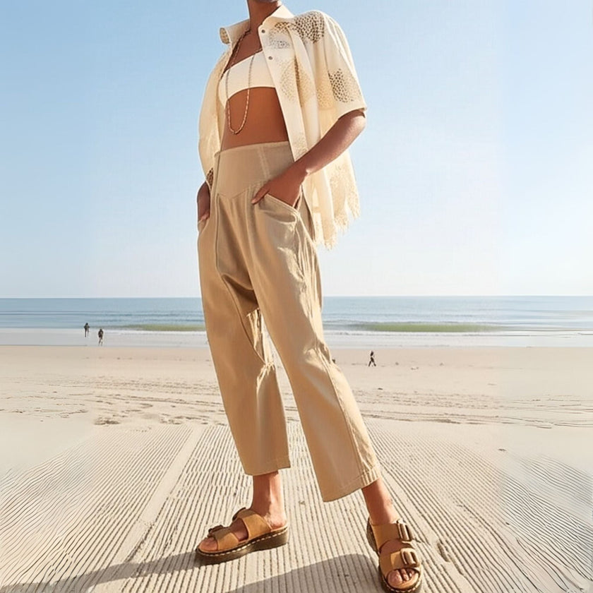 FJØRNA women's wide-leg denim trousers, stylish and comfortable pants featuring a classic blue wash and relaxed fit.
