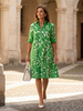 FJØRNA women's summer dress, lightweight wrap style, flowy and breathable fabric perfect for warm weather.