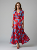 FJØRNA women's floral summer maxi dress with V-neck wrap design, flowing fabric, and vibrant floral pattern.