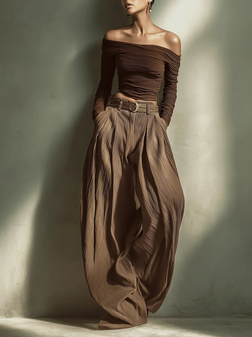 FJØRNA women's lightweight summer trousers with wide legs, high waist, and belt, made of comfortable, breathable fabric.