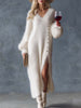 White knit V-neck midi dress for women by FJØRNA, featuring a fitted silhouette and soft, textured fabric.