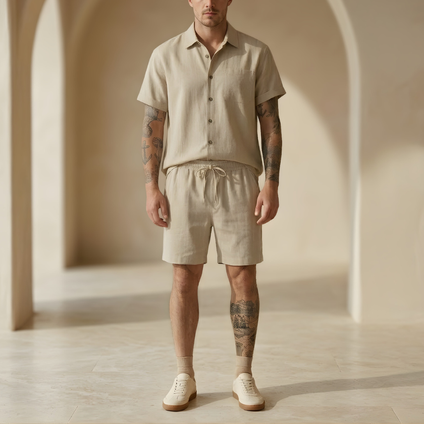 Men's linen blend shirt and shorts co-ord set by FJØRNA, perfect for summer vacation, shown in a casual daytime outfit.