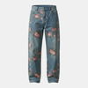 Unisex rose print wide-leg floral denim jeans by FJØRNA, showing the colorful rose pattern and relaxed fit on the pants.