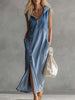 FJØRNA blue denim v-neck midi dress for women, casual style with a fitted waist and knee-length hem, displayed on a hanger.