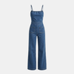 FJØRNA women's denim wide-leg jumpsuit with tie-back detail, featuring a stylish and comfortable sleeveless design.