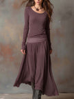 Charcoal knit maxi dress for women by FJØRNA, featuring a flowing silhouette and long sleeves, perfect for casual or elegant wear.