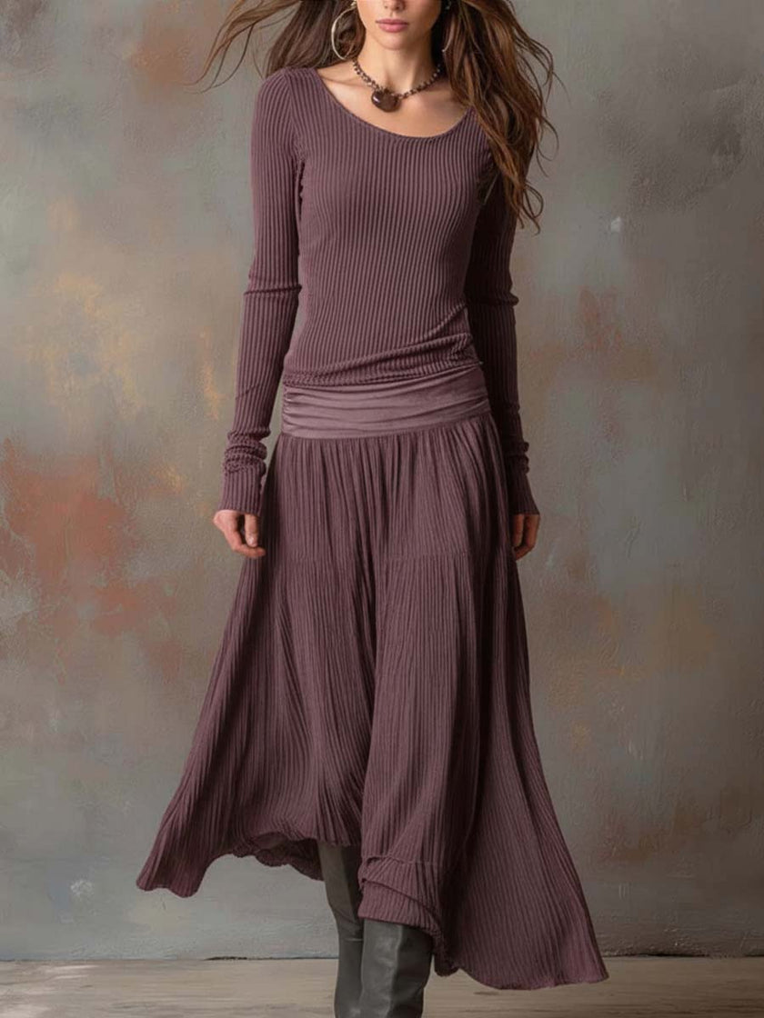 Charcoal knit maxi dress for women by FJØRNA, featuring a flowing silhouette and long sleeves, perfect for casual or elegant wear.
