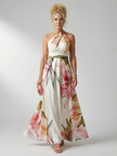 FJØRNA women's floral summer maxi dress with halter neck, sleeveless design, flowing fabric, ideal for warm weather.