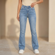 Women's high waist slim fit bootcut jeans by FJØRNA in cotton denim, showing the fit and classic denim texture.