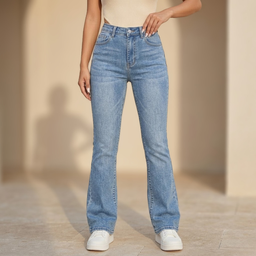 Women's high waist slim fit bootcut jeans by FJØRNA in cotton denim, showing the fit and classic denim texture.