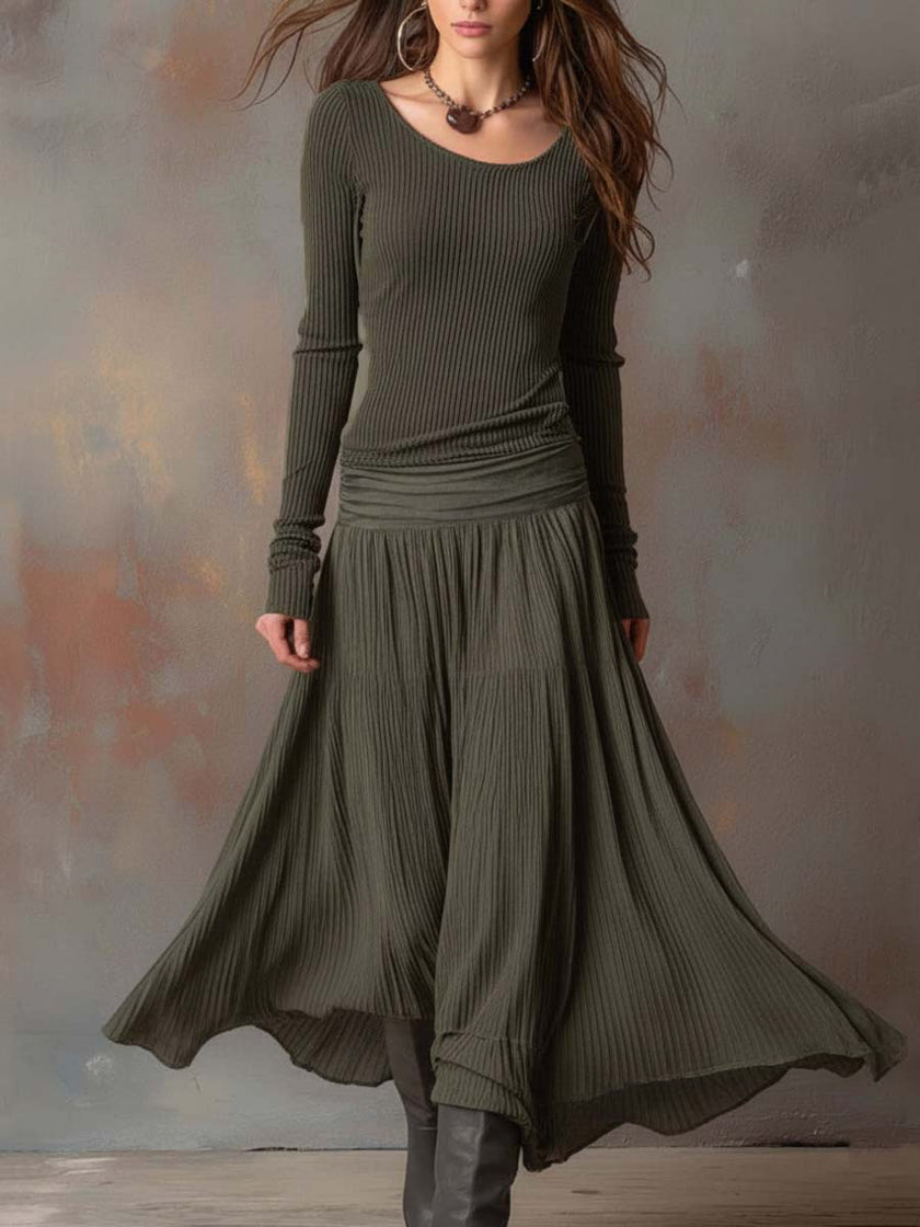 Charcoal knit maxi dress for women by FJØRNA, featuring a long, flowing silhouette and cozy textured fabric.