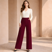 FJØRNA tailored high-waist wide-leg women's pants with a loose pull-on design, shown in a neutral color on a white background.