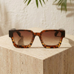 FJØRNA vintage 90s rectangular unisex sunglasses with retro style and black frame, accessories for women.