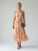 FJØRNA women's summer midi dress with halter neck and sleeveless design, featuring a flowy fabric and stylish silhouette.